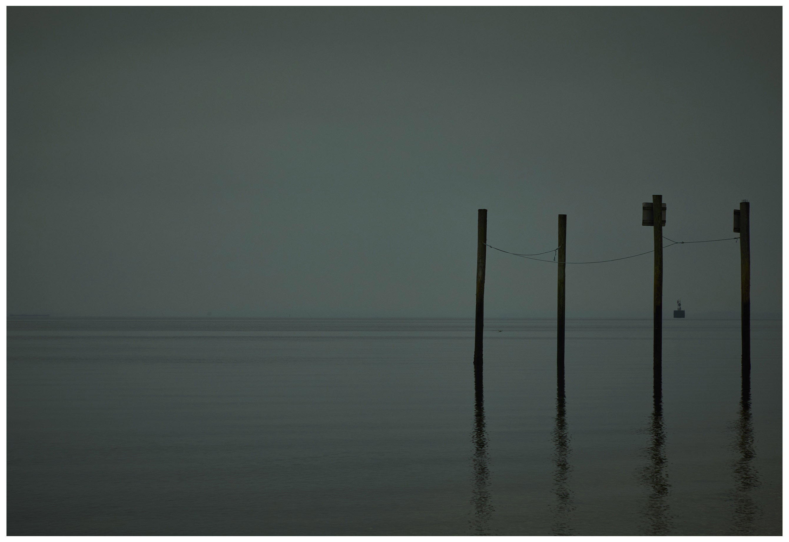 Four Pilings on a Foggy Day